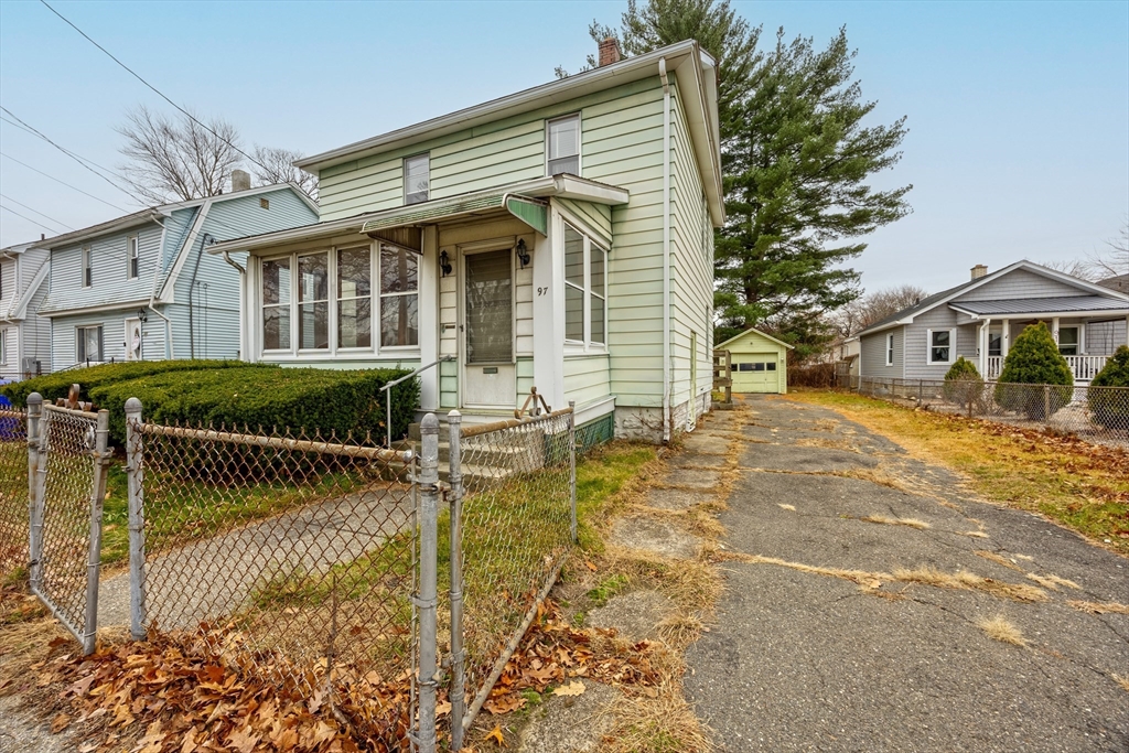 97 Oklahoma Street Springfield, MA 01104 - Photo 2 of 25 front view of house with a yard