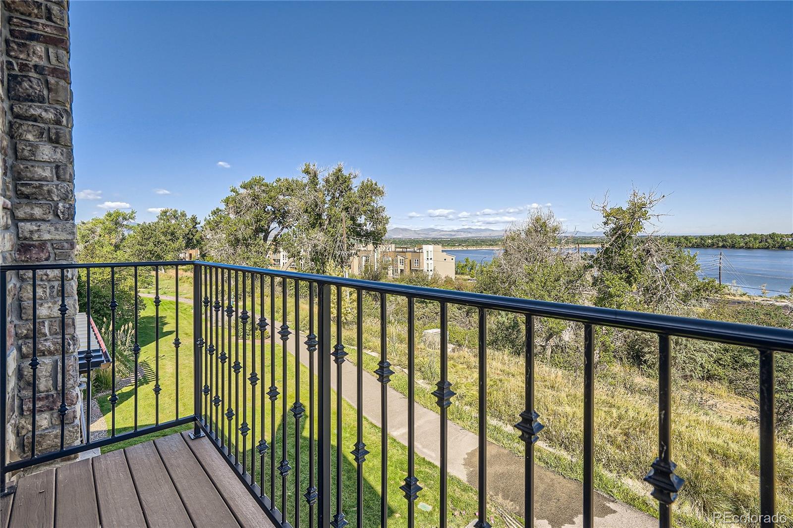 2317 Primo Road, Unit B Highlands Ranch, CO 80129 - Photo 4 of 38 a view of a balcony with wooden floor