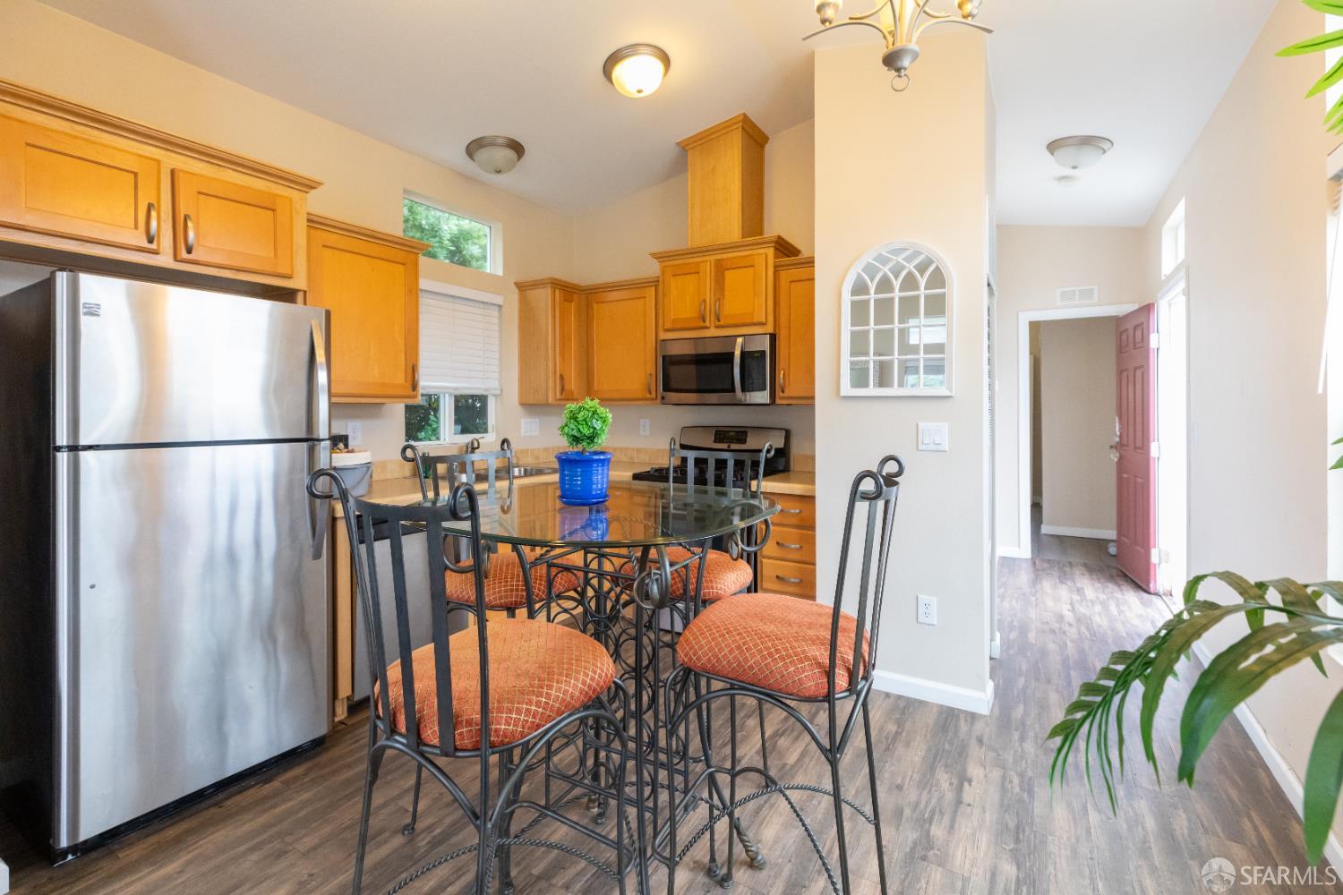 125 1st Avenue Pacifica, CA 94044 - Photo 14 of 55 a dining room with furniture and a refrigerator