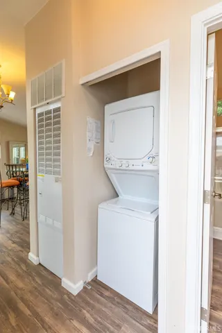 a bathroom with a sink shower and a mirror
