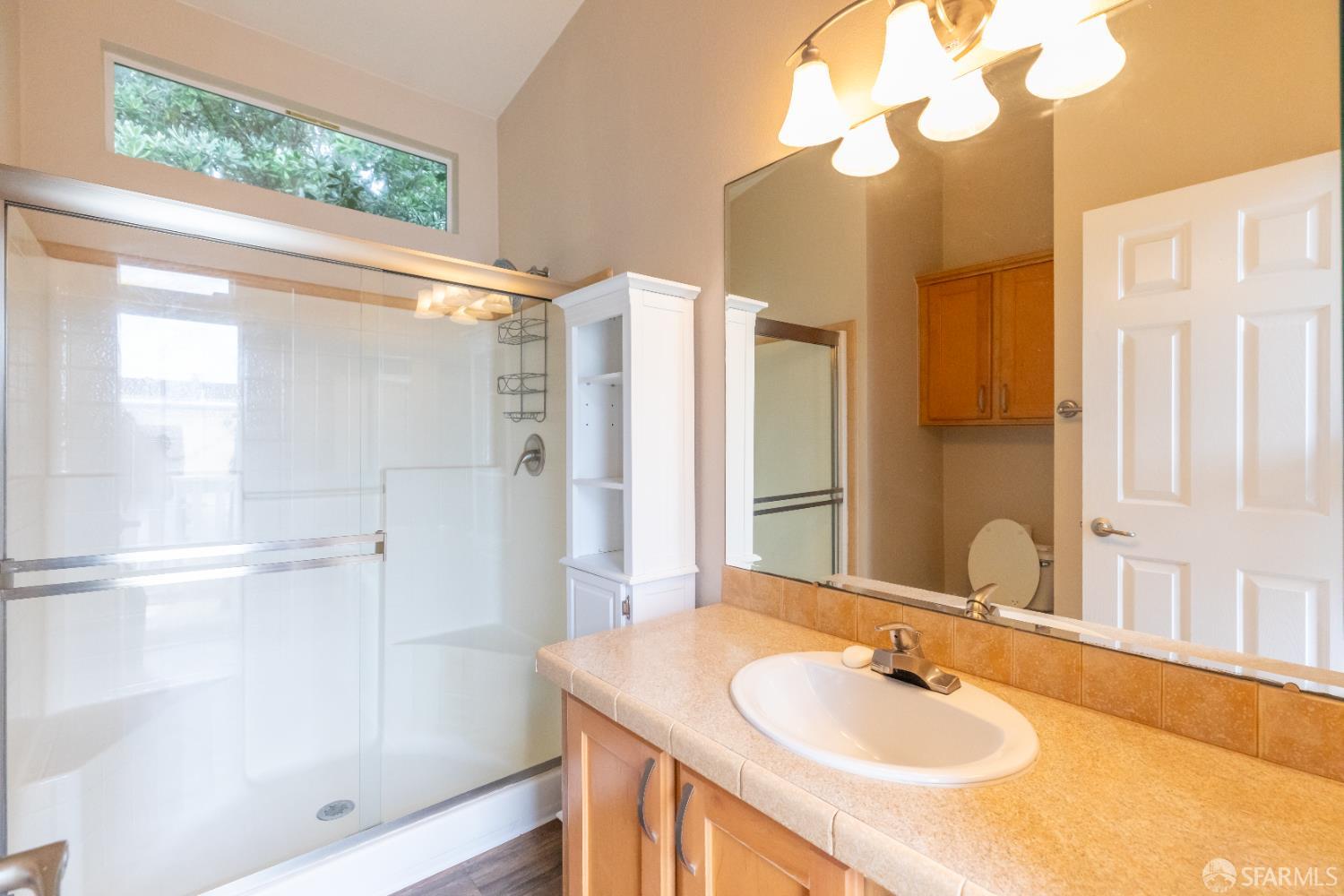 125 1st Avenue Pacifica, CA 94044 - Photo 17 of 55 a bathroom with a sink shower and a mirror