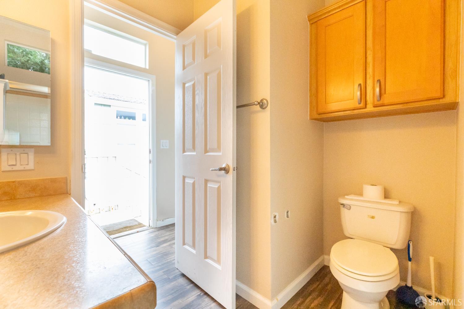 125 1st Avenue Pacifica, CA 94044 - Photo 18 of 55 a bathroom with a granite countertop toilet and a sink