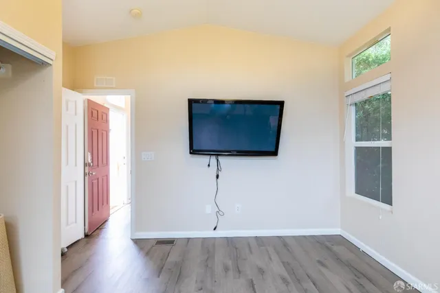 a view of living room with furniture and a window