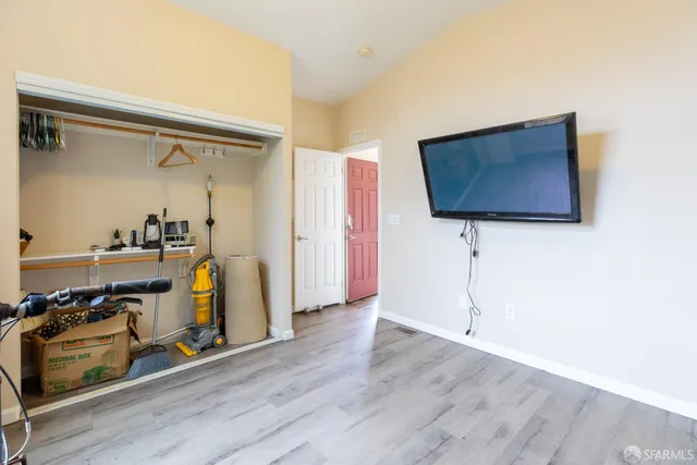a view of wooden floor in a room next to a window