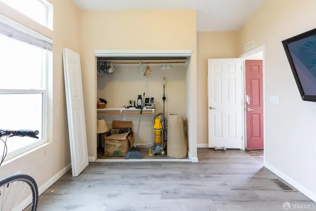 a view of an entryway with wooden floor