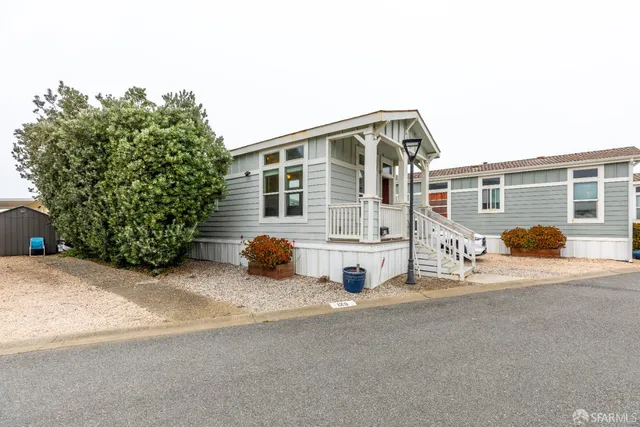 a view of a house with a bench