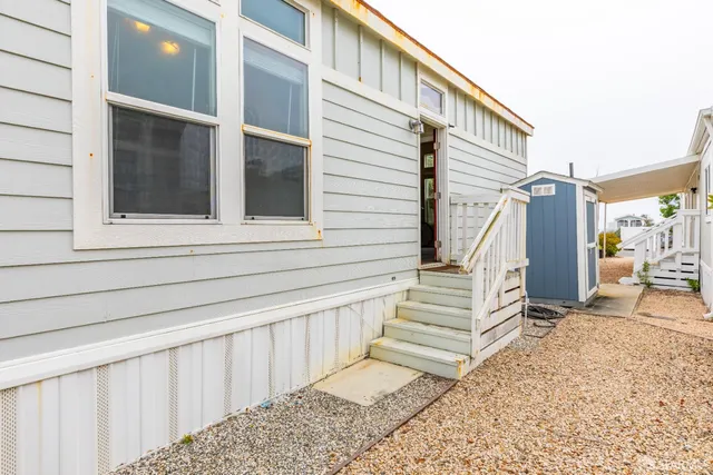 a view of a two chairs in the patio