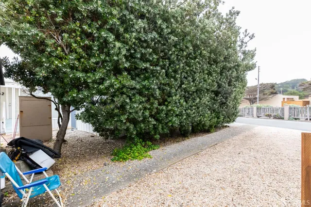 a view of a swimming pool and a yard