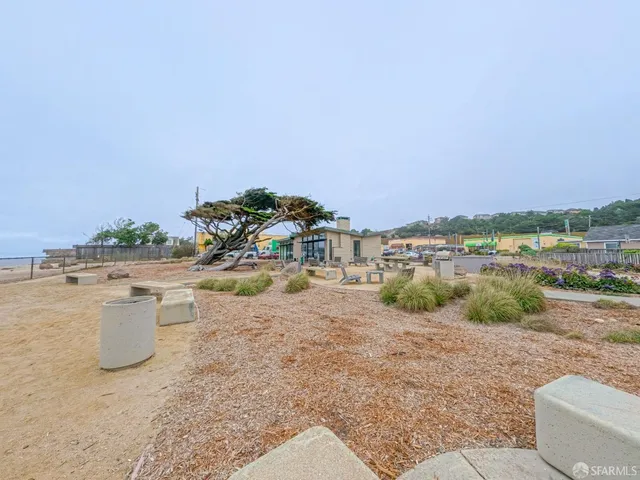 a view of a kitchen and an ocean
