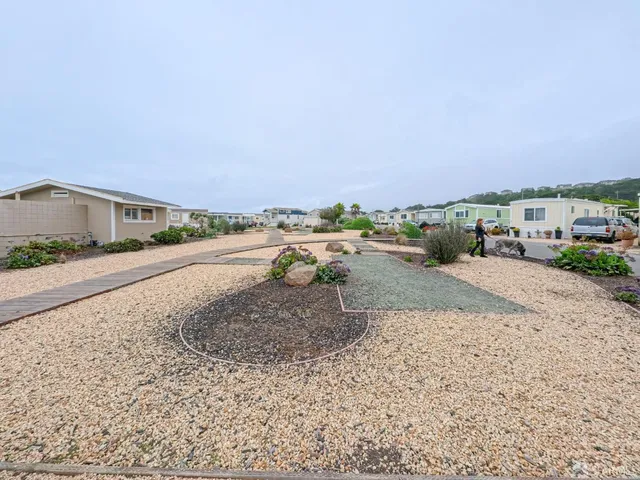 a view of a street with a building on the road