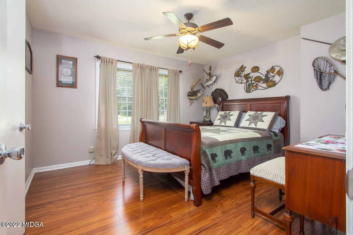 3663 Jones Road Macon, GA 31216 - Photo 16 of 30 a bedroom with a bed and a table in it