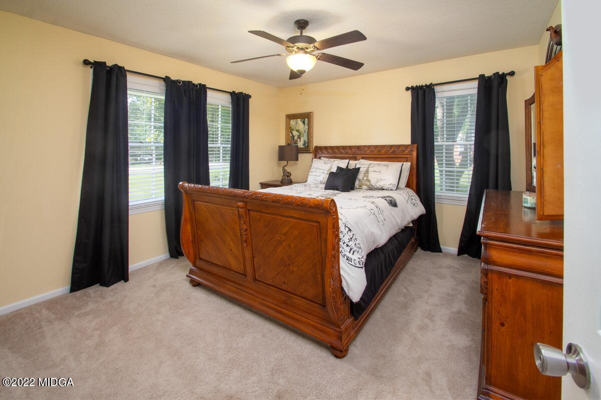 3663 Jones Road Macon, GA 31216 - Photo 18 of 30 a bed sitting in a bedroom next to a window