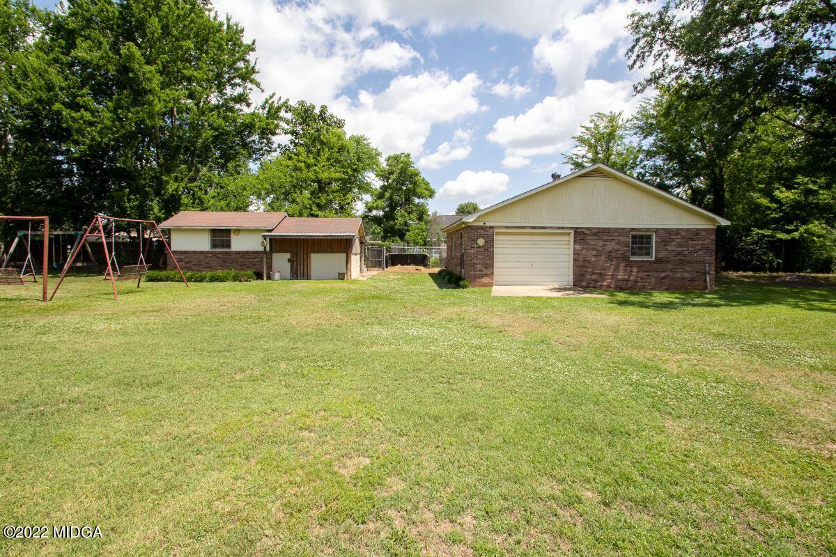 3663 Jones Road Macon, GA 31216 - Photo 23 of 30 a front view of a house with yard and green space