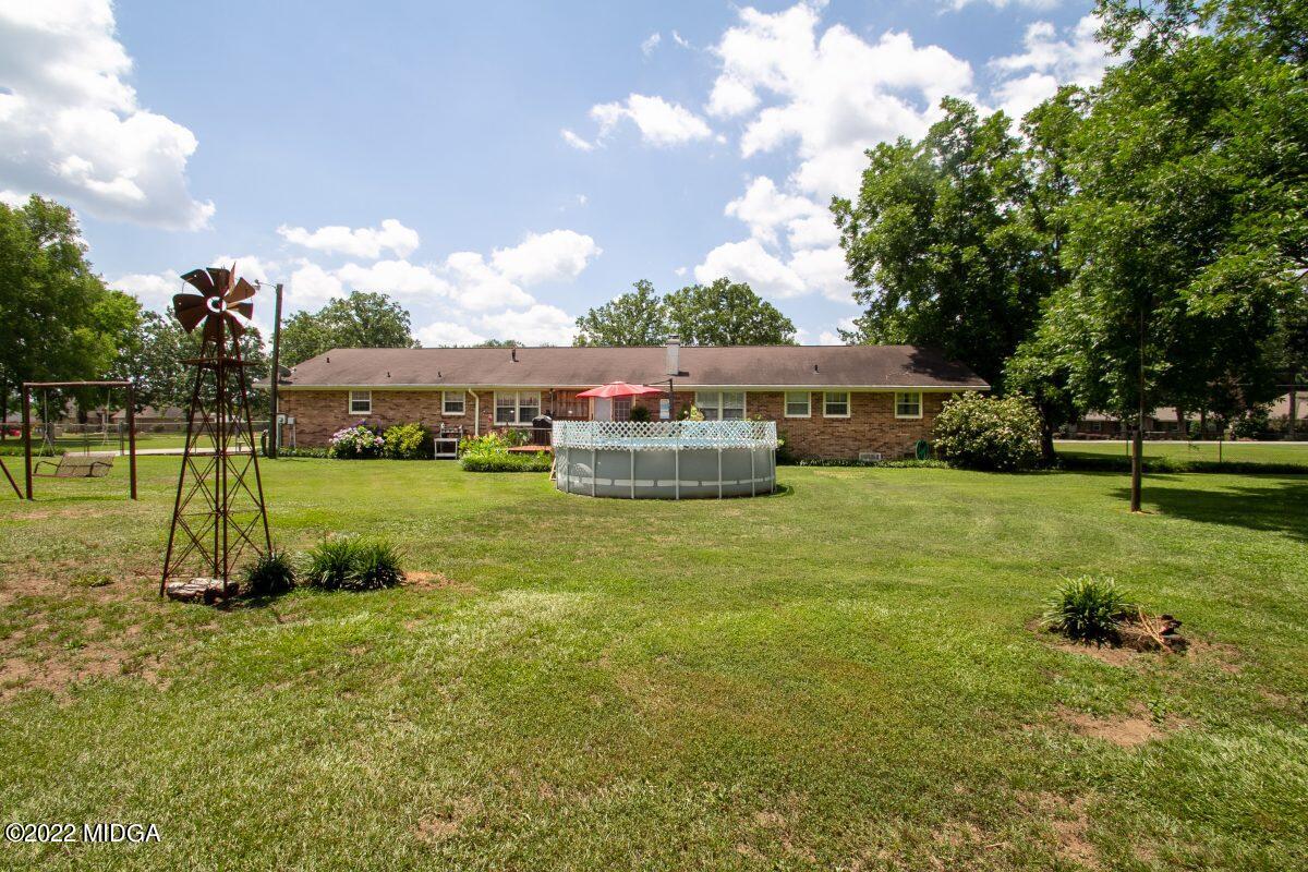 3663 Jones Road Macon, GA 31216 - Photo 26 of 30 a view of a house with a big yard and potted plants
