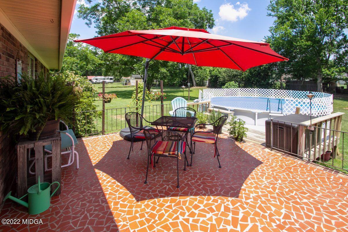 3663 Jones Road Macon, GA 31216 - Photo 27 of 30 a view of a house with backyard sitting area and garden