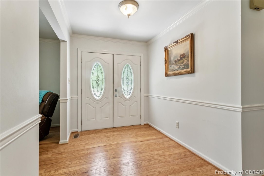 1635 Tyndall Point Road Gloucester Point, VA 23062 - Photo 4 of 50 Double door entry to foyer with HW floors