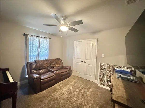 a living room with furniture and a window