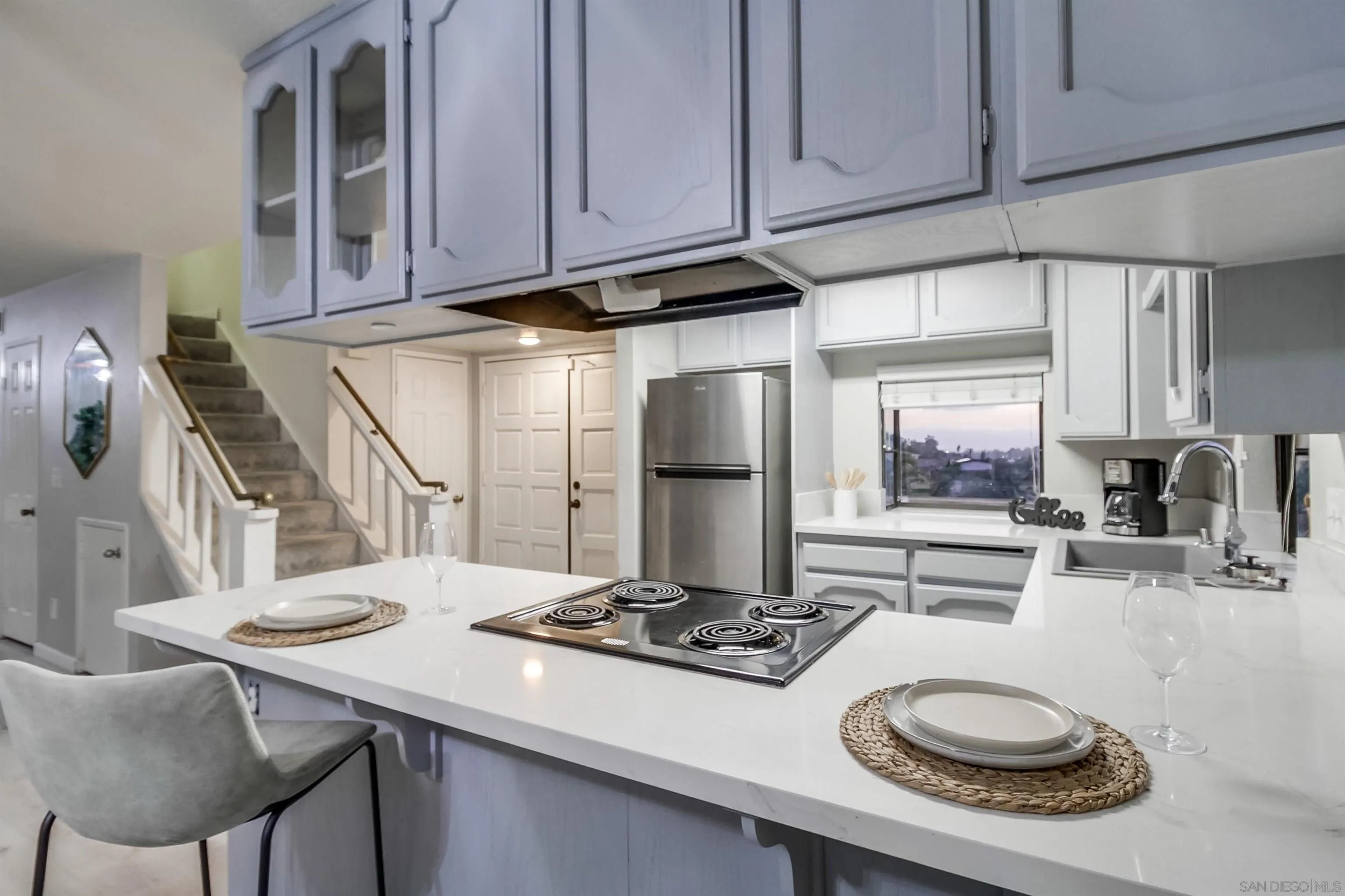 2351 Star Pine Drive Lemon Grove, CA 91945 - Photo 13 of 44 a kitchen with a table and chairs in it