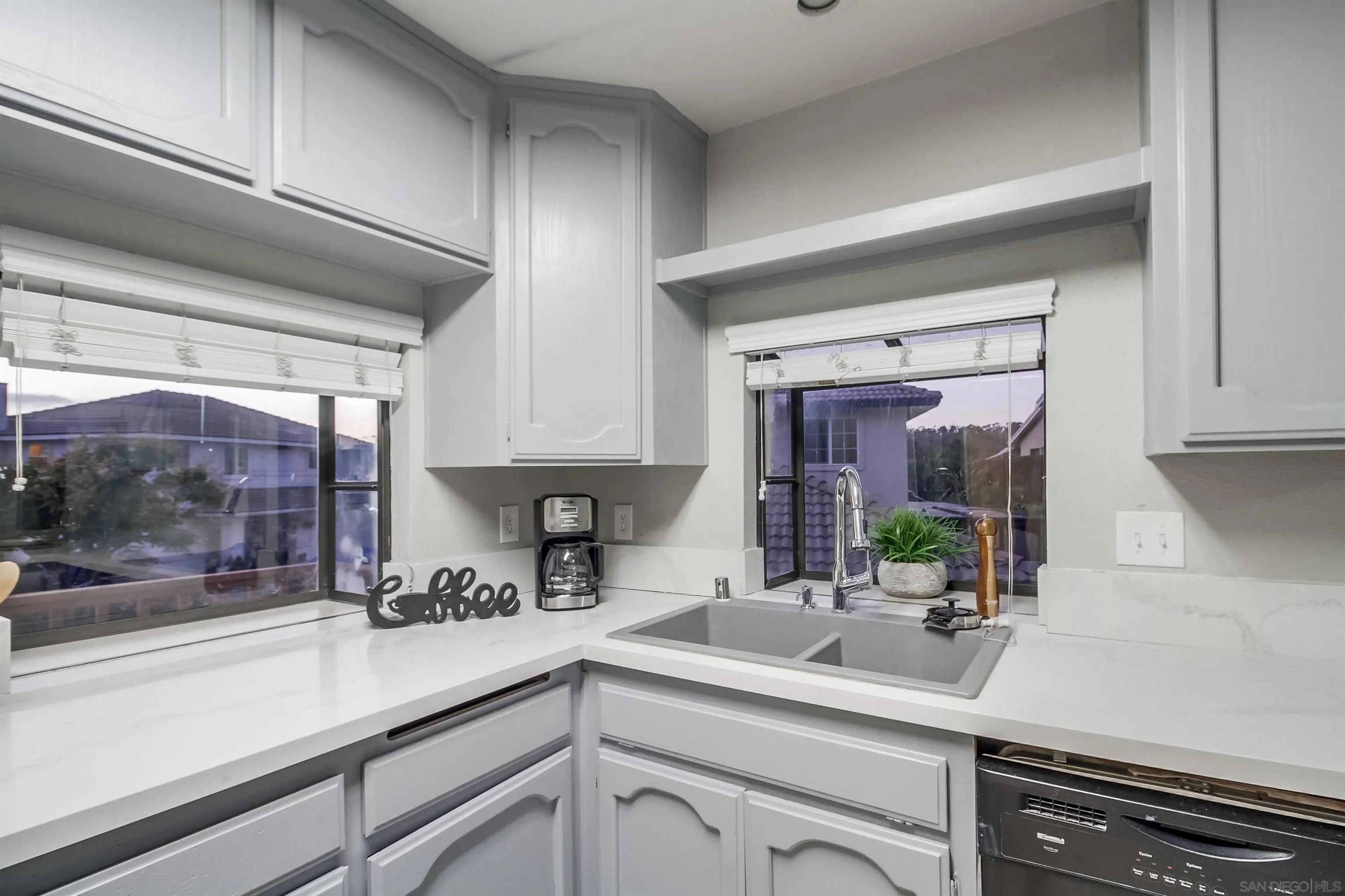 2351 Star Pine Drive Lemon Grove, CA 91945 - Photo 15 of 44 a kitchen with a sink and cabinets