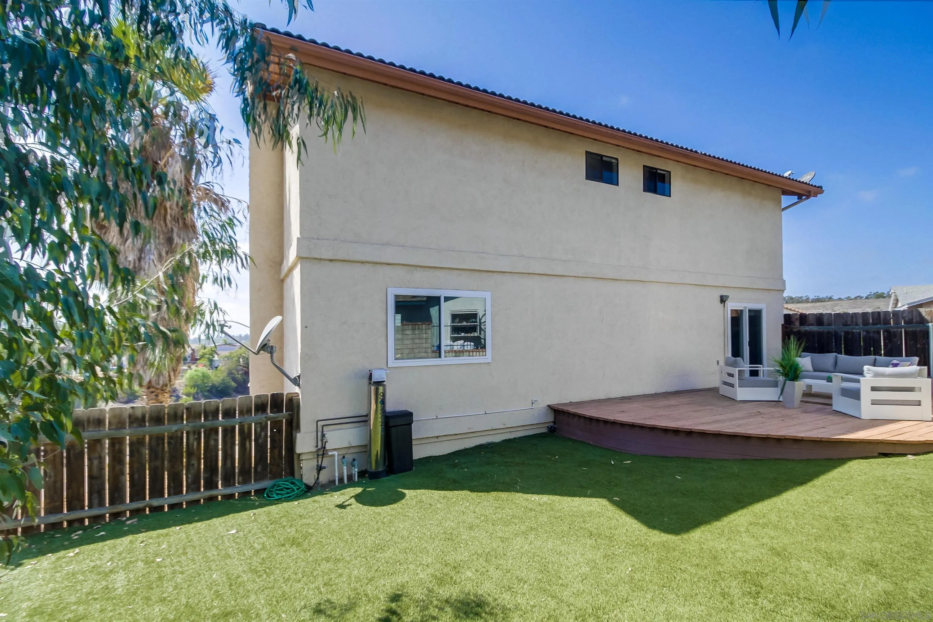 2351 Star Pine Drive Lemon Grove, CA 91945 - Photo 42 of 44 a backyard of a house with wooden deck and barbeque oven