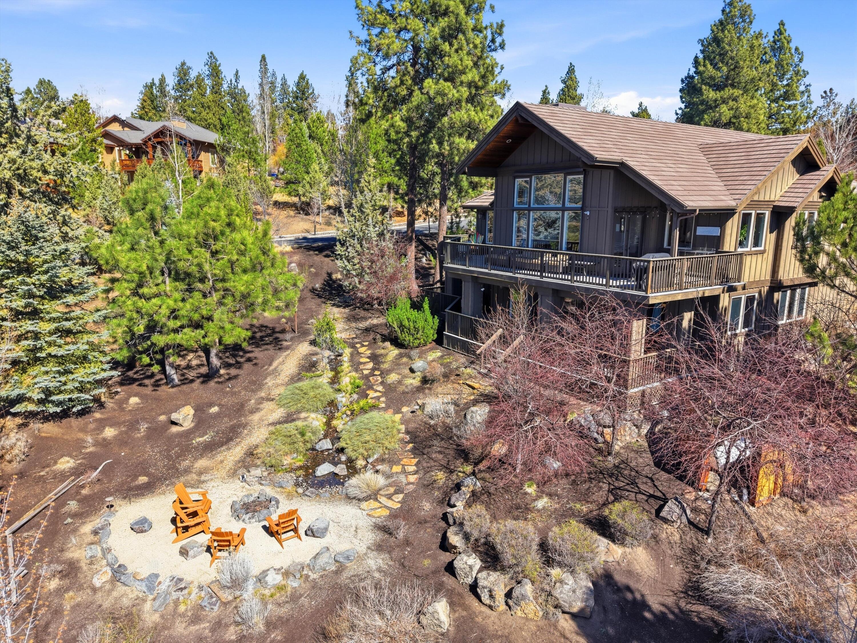 15 Southwest Quail Butte Place Bend, OR 97703 - Photo 55 of 55 a view of a house with a yard and sitting area