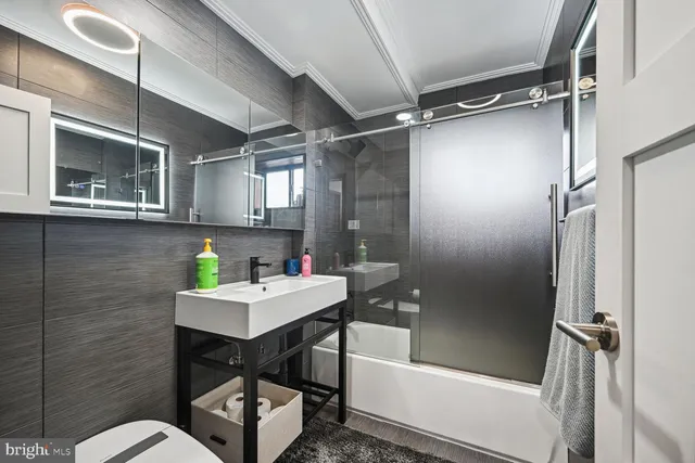 a bedroom with a large bed and a large window