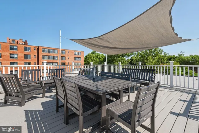 a view of a balcony with wooden floor