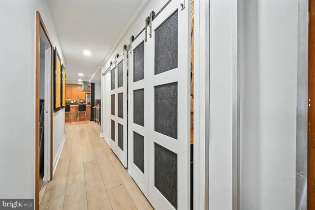 a view of gallery with wooden floor