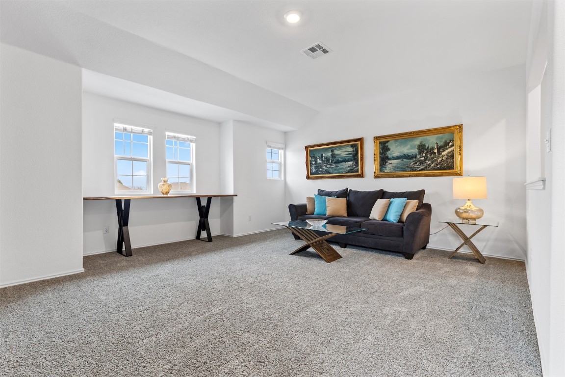 432 Clear Springs Road Georgetown, TX 78628 - Photo 13 of 27 Living room with carpet and baseboards