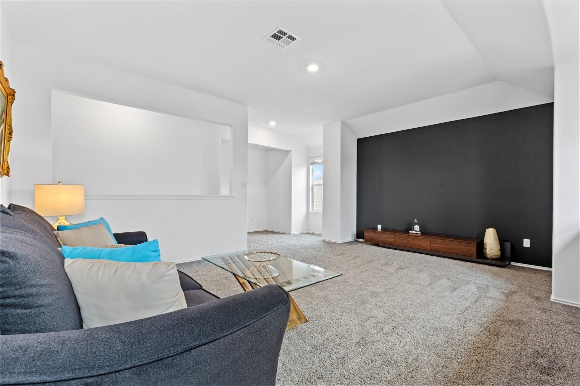 432 Clear Springs Road Georgetown, TX 78628 - Photo 14 of 27 Living area featuring carpet flooring and recessed lighting