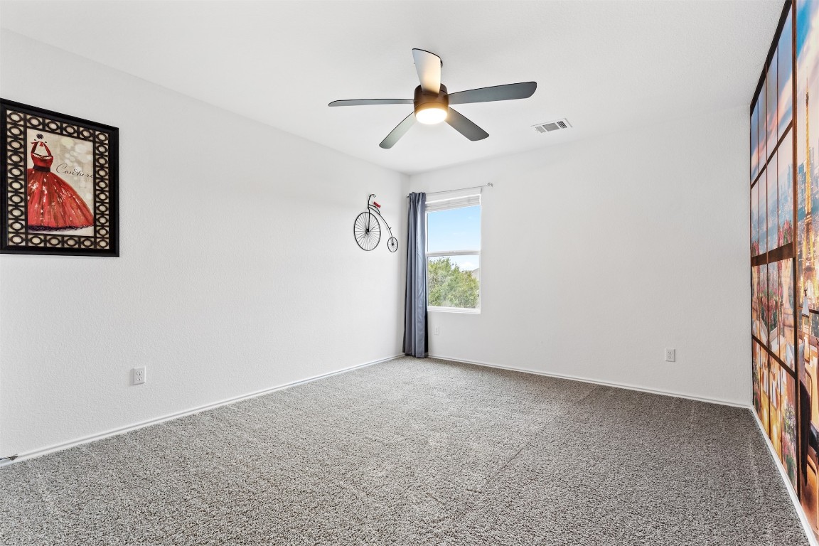432 Clear Springs Road Georgetown, TX 78628 - Photo 18 of 27 Spare room with carpet and ceiling fan