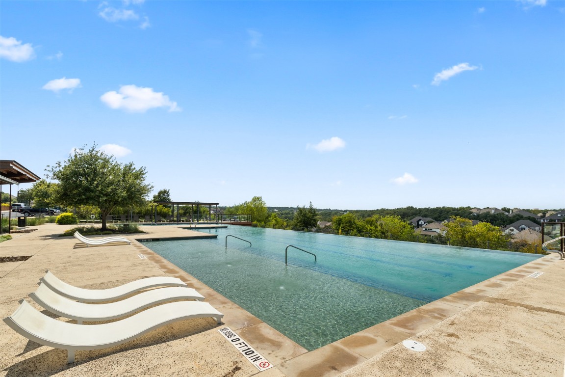 432 Clear Springs Road Georgetown, TX 78628 - Photo 22 of 27 Community pool featuring a patio area