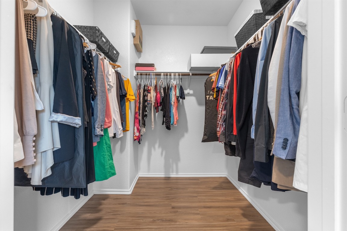 432 Clear Springs Road Georgetown, TX 78628 - Photo 9 of 27 Walk in closet featuring wood finished floors