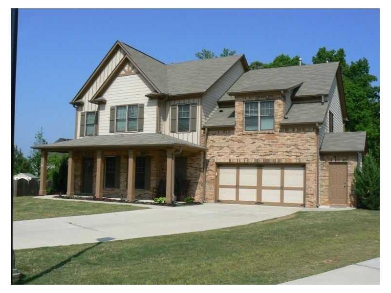 2068 Bluebell Street Dacula, GA 30019 - Photo 1 of 1 a front view of a house with a yard