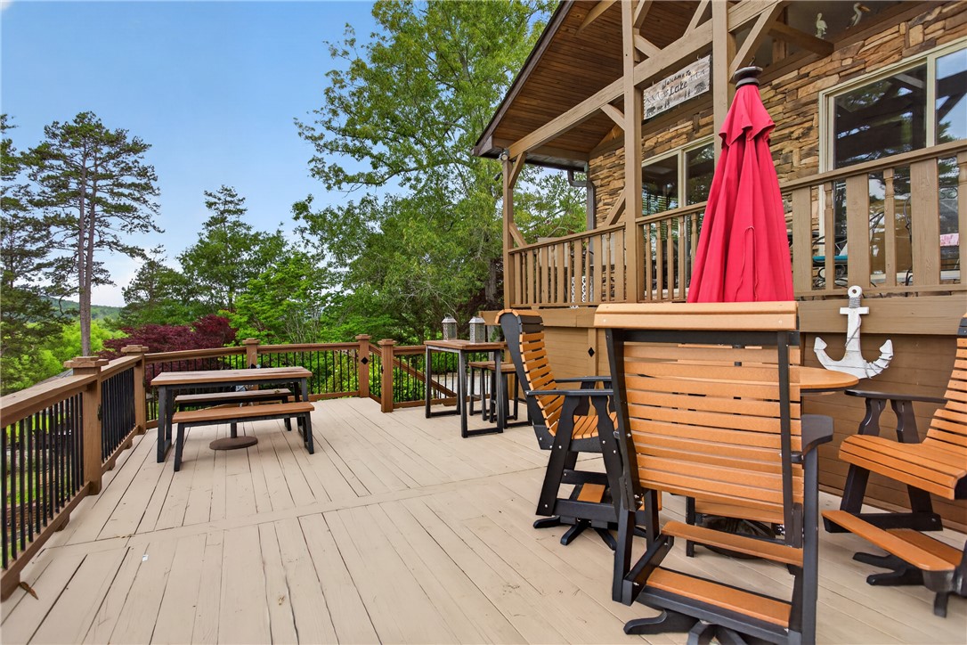 351 River Road Westminster, SC 29693 - Photo 41 of 50 An expansive deck provides outdoor living with lush tree-lined views and multiple seating areas.