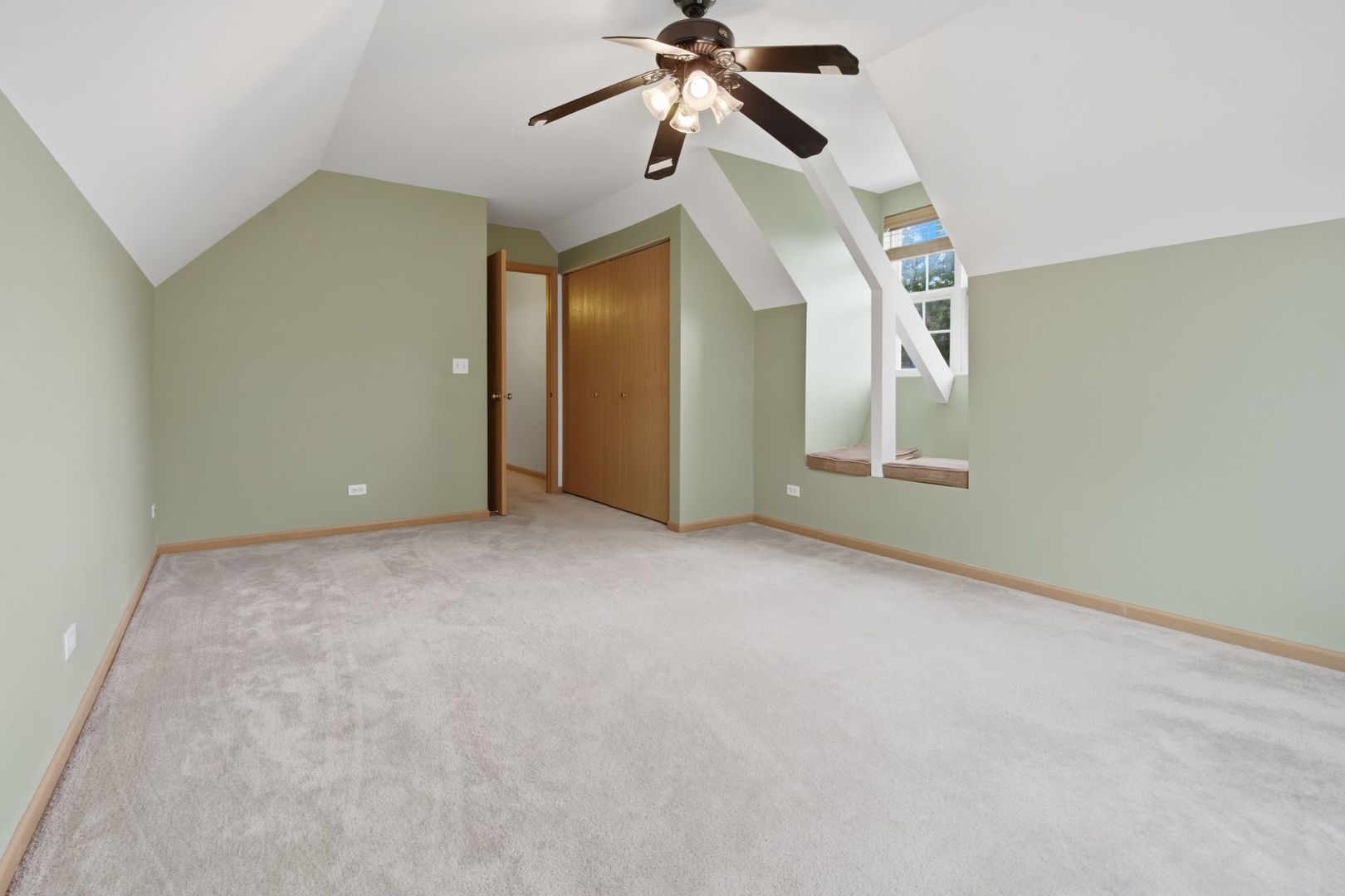1758 Edith Lane Aurora, IL 60504 - Photo 14 of 28 a view of a big room with ceiling fan and windows