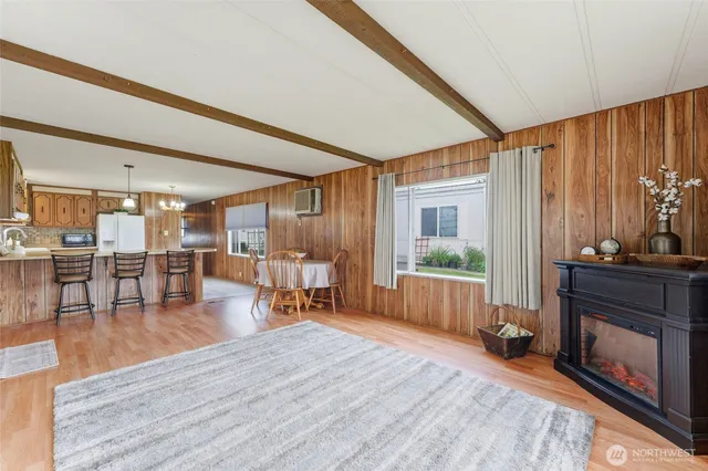 a livingroom with furniture and a fireplace