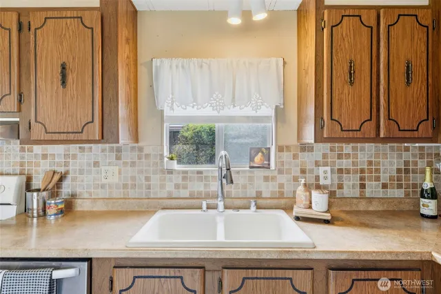 a kitchen with a sink and a window