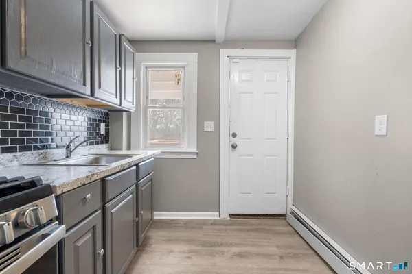 a kitchen with a sink and cabinets