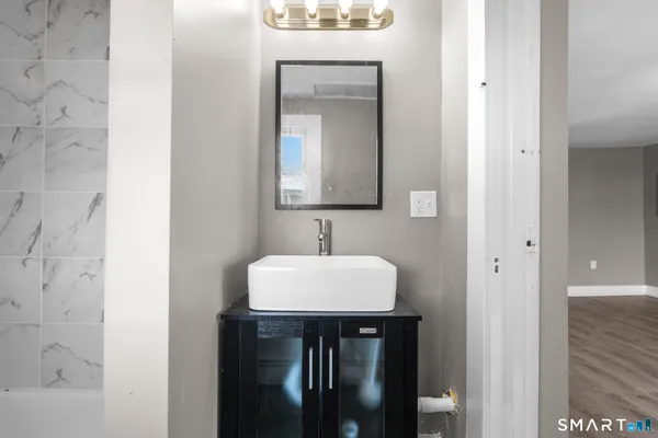 a bathroom with a sink and a mirror