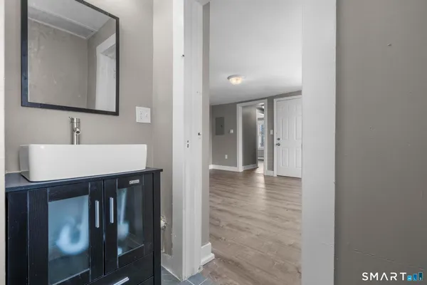 a bathroom with a sink and a mirror