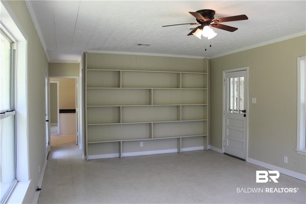 5710 Antoine Road Mobile, AL 36693 - Photo 7 of 7 Empty room with a ceiling fan and ornamental molding