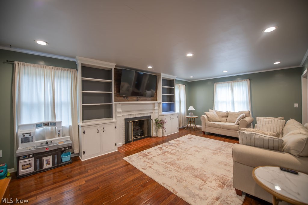 827 East 5th Street Dover, OH 44622 - Photo 10 of 38 Spacious living room featuring a cozy fireplace