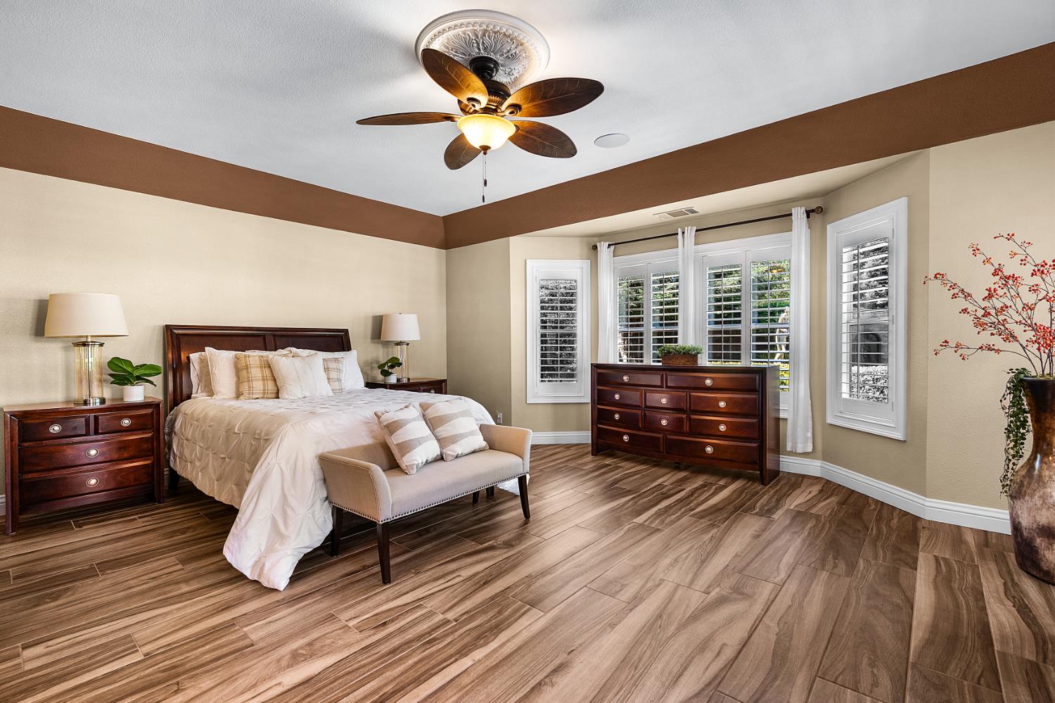 8300 Auburn Folsom Road Granite Bay, CA 95746 - Photo 15 of 45 a bedroom with a bed dresser and a large window