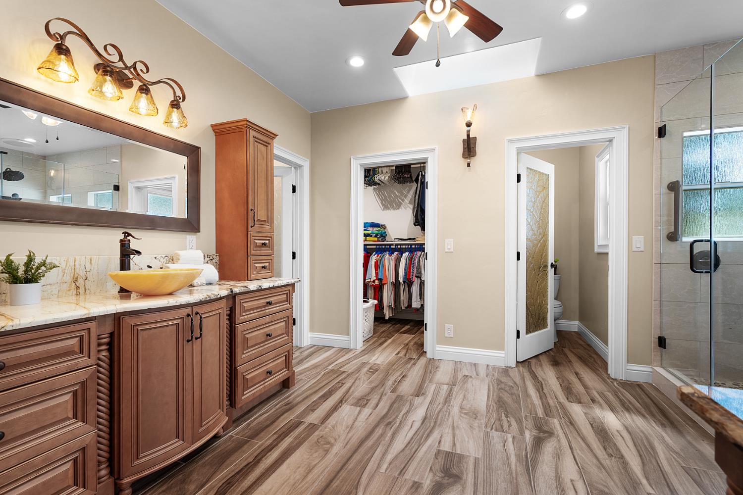 8300 Auburn Folsom Road Granite Bay, CA 95746 - Photo 18 of 45 a kitchen with a sink and wooden floor