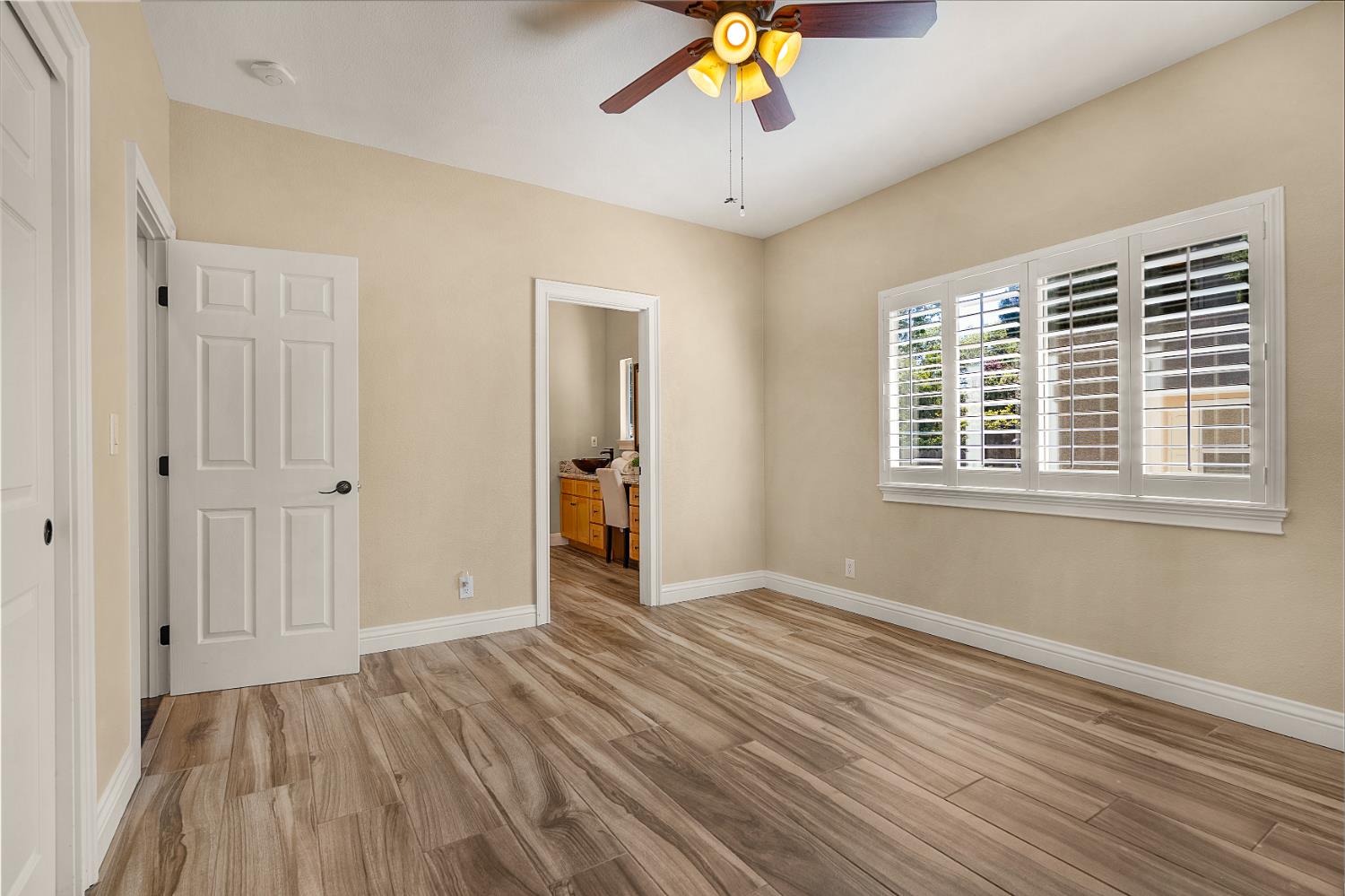 8300 Auburn Folsom Road Granite Bay, CA 95746 - Photo 21 of 45 a view of an empty room with wooden floor and a window