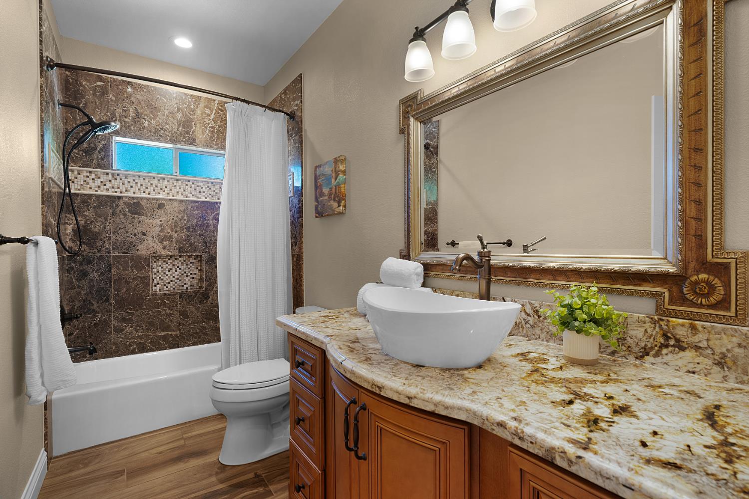 8300 Auburn Folsom Road Granite Bay, CA 95746 - Photo 23 of 45 a bathroom with a granite countertop sink a toilet a mirror and shower