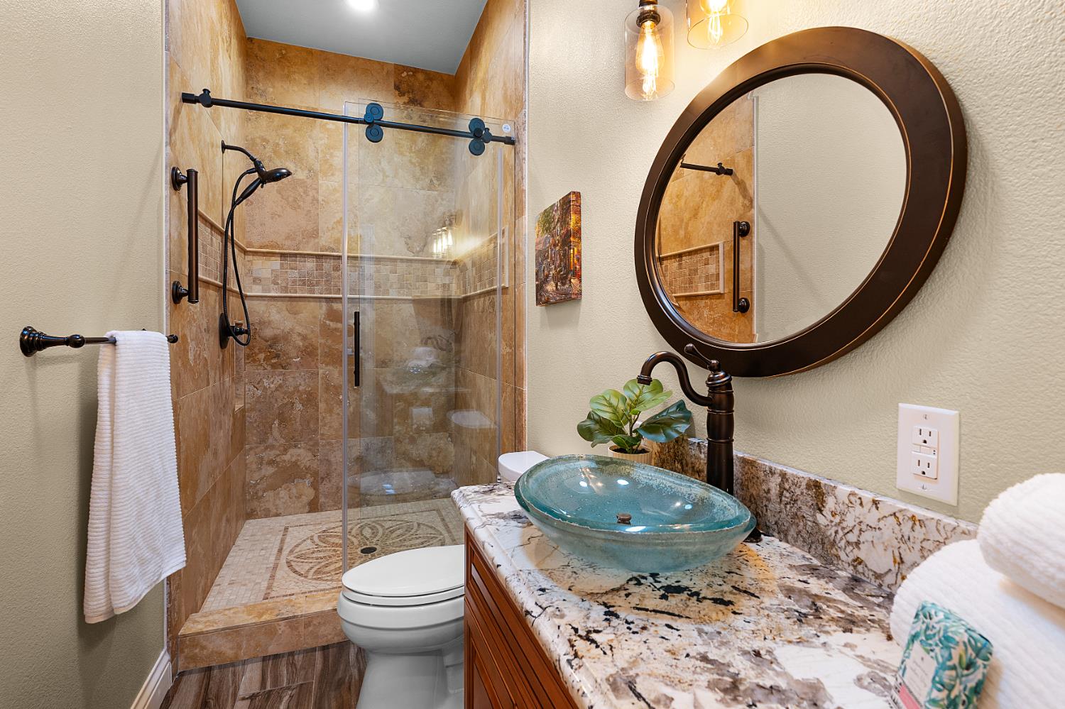 8300 Auburn Folsom Road Granite Bay, CA 95746 - Photo 24 of 45 a bathroom with a sink a toilet and a mirror