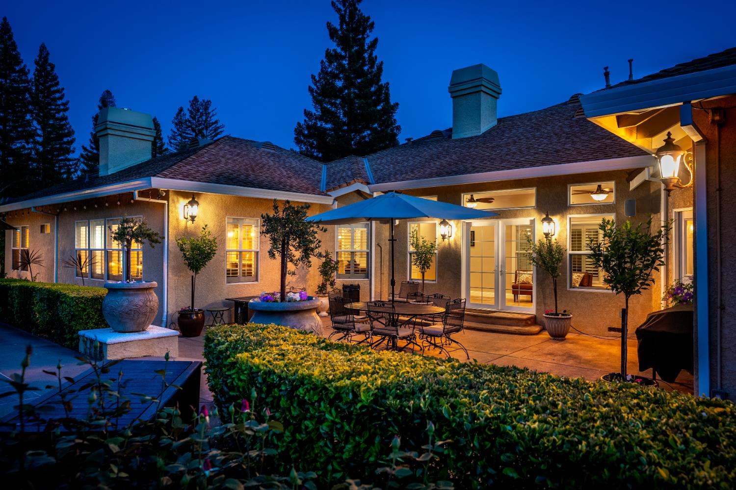 8300 Auburn Folsom Road Granite Bay, CA 95746 - Photo 32 of 45 a view of a patio with table and chairs under an umbrella