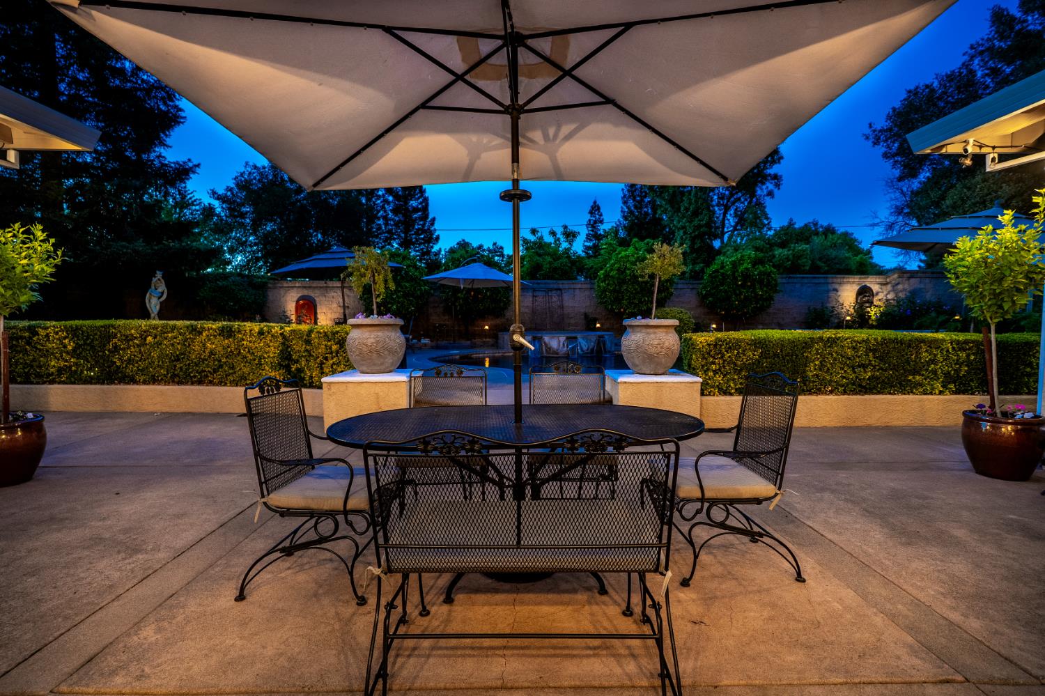 8300 Auburn Folsom Road Granite Bay, CA 95746 - Photo 34 of 45 a view of patio with table and chairs under an umbrella